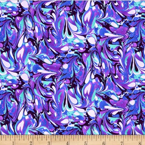 May include: Fabric with a swirling pattern in shades of purple, blue, teal, and white. The design resembles a marbled effect, with fluid, abstract shapes. The fabric is measured with a wooden ruler in inches.