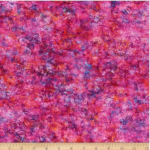 May include: A vibrant fabric with a complex pattern in shades of pink, magenta, and purple, with hints of orange and blue. The design features swirling, floral, and circular motifs. The fabric is measured with a ruler in inches.