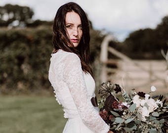 EMERALD TOP an ivory corded lace fitted top with long sleeves and button fastening at the back