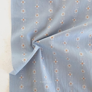 May include: A set of three ceramic mugs with a speckled, matte finish. The mugs are in shades of cream, light gray, and dark gray. Each mug has a simple, minimalist design and a rounded handle.