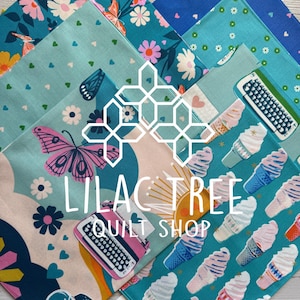 May include: A collection of colorful fabric squares with various patterns. Designs include butterflies, flowers, ice cream cones, and typewriters. The text "LILAC TREE QUILT SHOP" is displayed in the center. The fabrics are in shades of blue, pink, and teal.