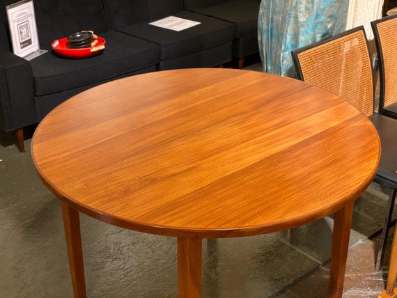 Danish Modern Butterfly Leaf Afrormosia Teak Extending Dining Table, Circa 1950s - Please ask for a shipping quote before you buy.