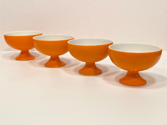 Set of Four Porcelain Orange Footed Bowls