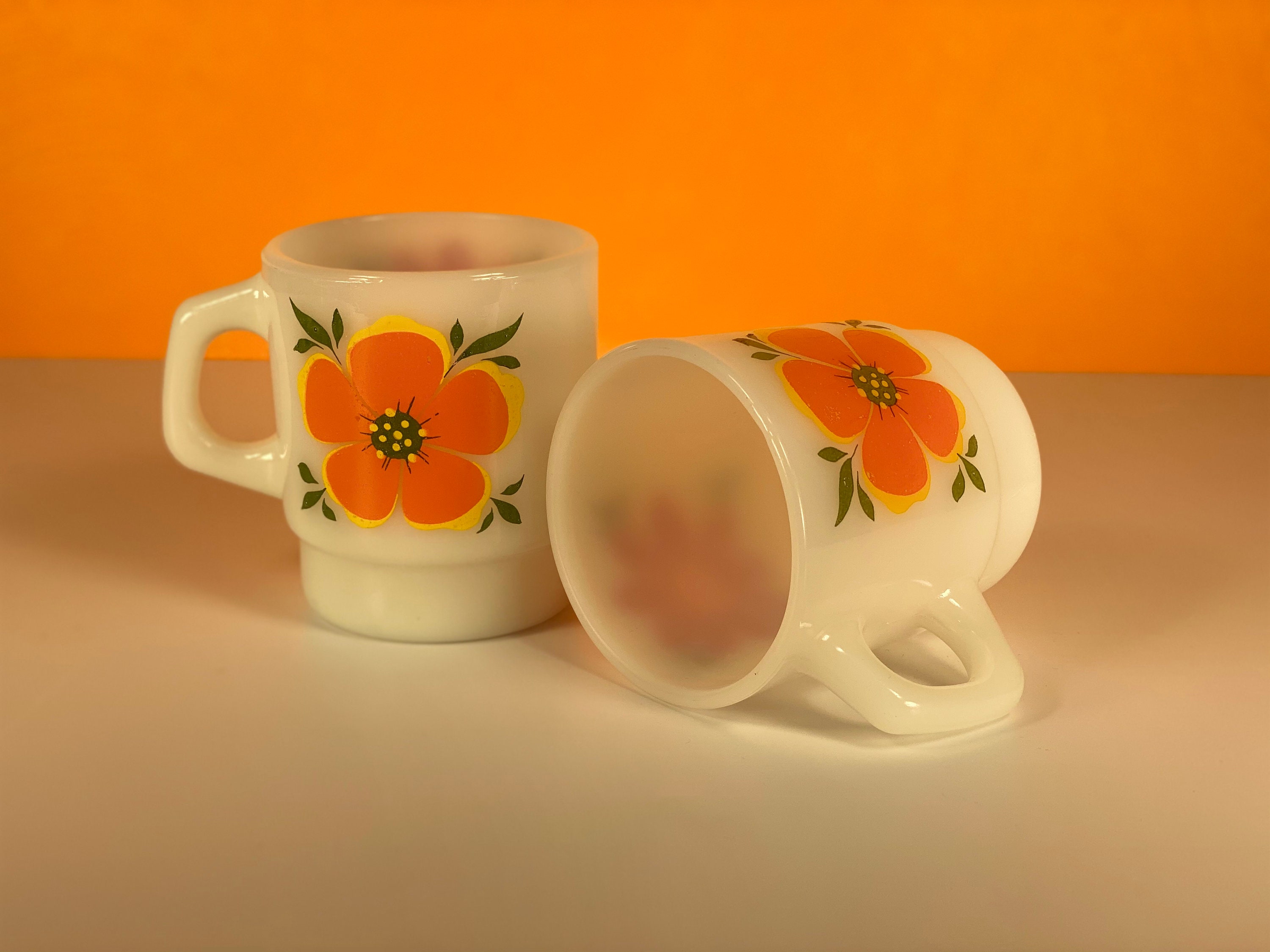 Pair - Fire King Orange & Red Flower Mugs