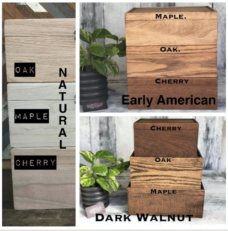 May include: Three wooden boxes stacked on top of each other, showing different wood stains. The top box is labeled "Maple", the middle box is labeled "Oak", and the bottom box is labeled "Cherry". The boxes are labeled "Early American".