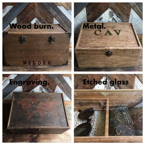 May include: Four wooden boxes with different designs. One box has the word "WILDER" on it. Another box has the letters "CAV". One box has a world map engraved on it. The last box has etched glass with text.