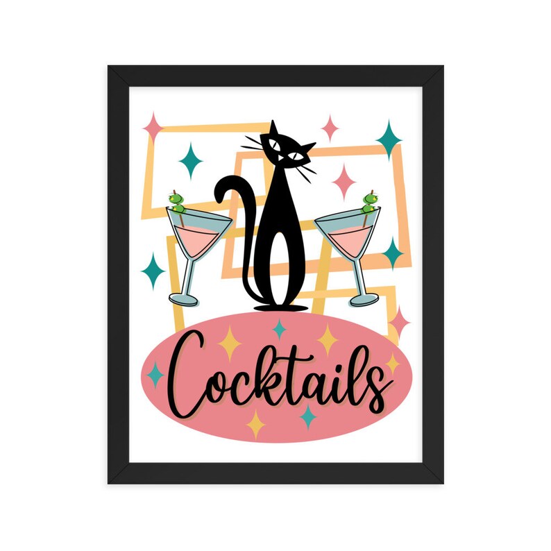 May include: A framed print with a retro design featuring a black cat with two martini glasses and the text "Cocktails". The background is a pink oval with yellow, teal, and white stars.