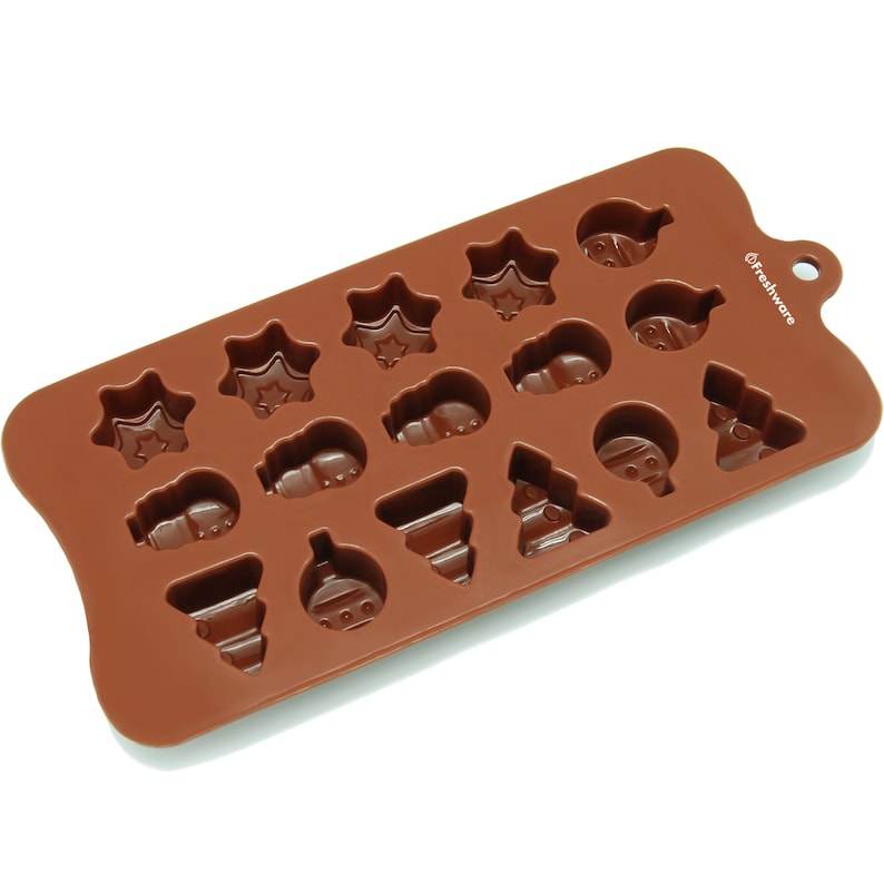 May include: Brown silicone mold with 16 cavities shaped like Christmas ornaments, stars, and trees. The mold is labeled "Freshware".