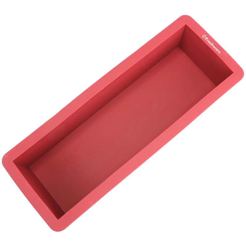 May include: A red silicone loaf pan with the text "Freshware" on the side.