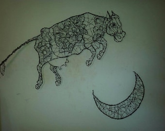 May include: A black wire sculpture of a cow jumping over a crescent moon. The cow is made of wire and has a detailed design. The moon is also made of wire and is a simple crescent shape.