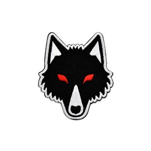 May include: Embroidered patch depicting a black wolf's head with red eyes and white detailing. The wolf design has a jagged edge, ideal for application on clothing or accessories. A striking emblem.