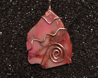 Wire wrapped pink stone pendant