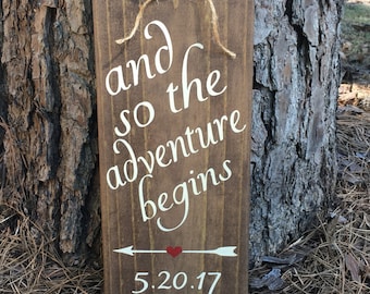 And so the adventure begins wood sign