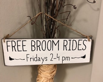 Free Broom Rides painted wood sign; approx 2 1/2 x 8" on 1/4" wood