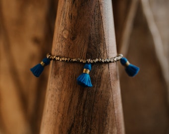 gold faceted bead bracelet with mini cream colored tassels | stacking bracelets | boho bracelets