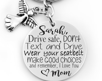 May include: Silver keychain with an angel charm and a round tag that reads "Sarah, Drive safe, DON'T Text and Drive Wear your seatbelt make Good Choices and remember, I Love You Mom".