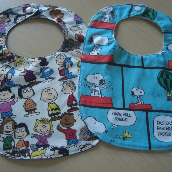 Baby bibs made with licensed Snoopy, Charlie Brown fabric. Great shower or gender reveal gift. Bibs for boy or girl