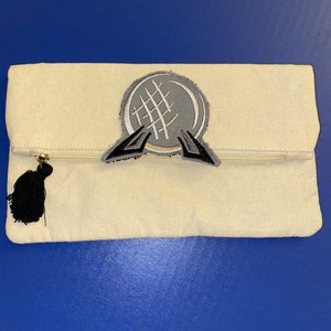 VENTA - Clutch de lona Spaceship Earth