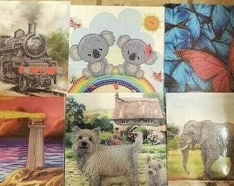 May include: Set of 10 diamond painting kits featuring various designs, including a train, lighthouse, koalas, butterfly, and elephant. Each kit includes a canvas, rhinestones, and tools.