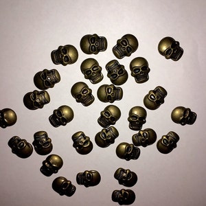 CraftbuddyUS 50 pc 11*16mm, Brass Metal Hot FIX Skull Studs stick on Embellishments,PUNK,GOTH