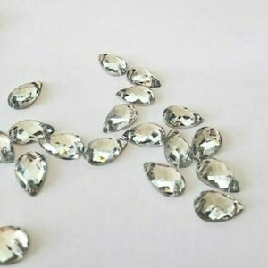 CraftbuddyUS 100pcs 10x6mm Sew On Clear Teardrop Acrylic Diamante Rhinestone Crystal Gems
