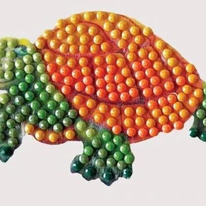 May include: A colorful turtle figurine with a mosaic design. The turtle's shell is covered in orange and yellow beads, while the head, legs, and tail are green. The figurine is a decorative item.