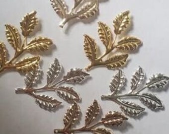 May include: Five gold and silver leaf branch embellishments. The branches have multiple leaves and are perfect for adding a touch of elegance to crafts and projects.