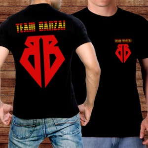 May include: Black t-shirts with a red and yellow graphic design. The front of the shirt features a red diamond-shaped logo, and the back displays the words "TEAM BANZAI!" in red and yellow. The same text and logo are on the front.