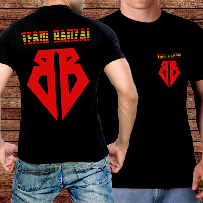May include: Black t-shirts with a red and yellow graphic design. The front of the shirt features a red diamond-shaped logo, and the back displays the words "TEAM BANZAI!" in red and yellow. The same text and logo are on the front.