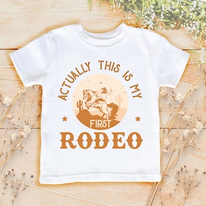 Actually This Is My First Rodeo Shirt | Cute Cowboy Cowgirl Pregnancy Announcement Bodysuit  | horse Rodeo Bodysuit | Yeehaw Tee | 839