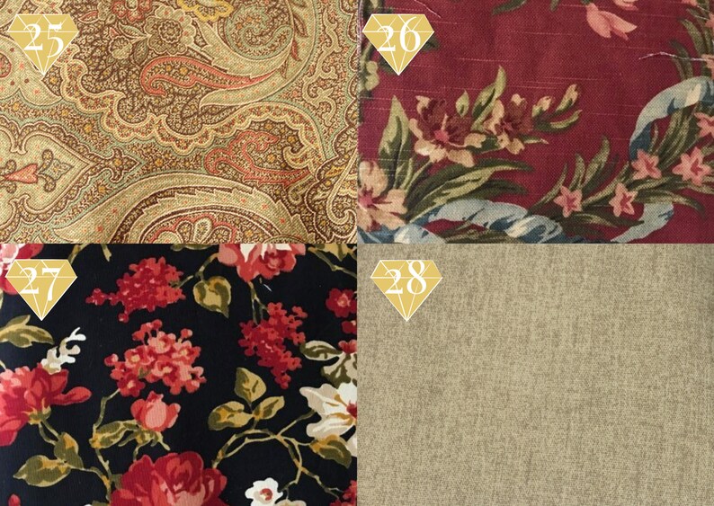 May include: Four fabric swatches, each with a different pattern. The top left swatch is a paisley pattern in shades of brown, beige, and red. The top right swatch is a floral pattern in shades of red, pink, and green on a burgundy background. The bottom left swatch is a floral pattern in shades of red and white on a black background. The bottom right swatch is a solid beige fabric with a subtle texture.