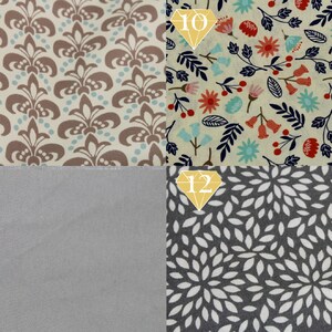 May include: Four fabric swatches with different patterns. The top left swatch has a brown and cream damask pattern. The top right swatch has a floral pattern with red, blue, and green flowers on a cream background. The bottom left swatch is a solid gray. The bottom right swatch has a white leaf pattern on a gray background.