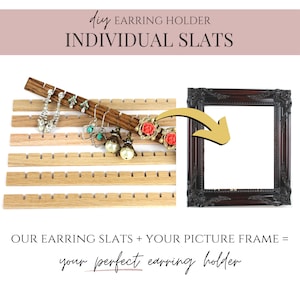 May include: DIY earring holder made from individual wooden slats that can be placed in a picture frame. The image shows a set of wooden slats with earrings hanging on them and a dark brown picture frame.