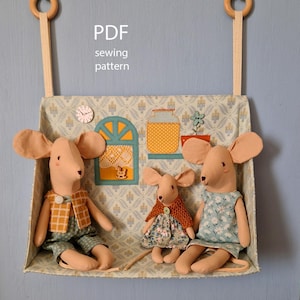 May include: A fabric shelf with three stuffed mice, a window, and a jar. The shelf is decorated with a patterned fabric and wooden accents. The text "PDF sewing pattern" is visible.