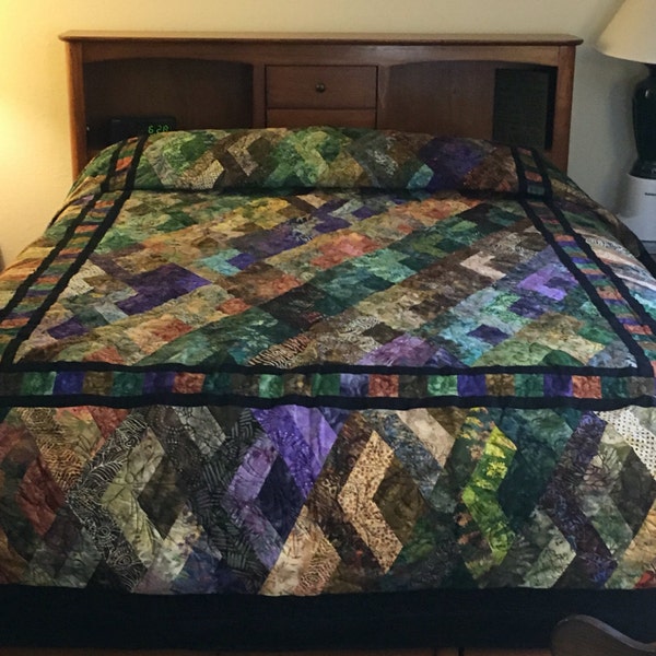 Absolutely stunning vibrant colors make up this queen size batik quilt