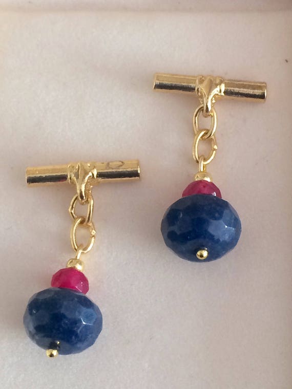 Gilt cufflinks with Faceted Ruby and sapphire cabo