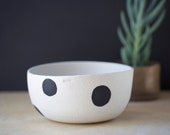 Ceramic/ pottery kitchen bowl. Handmade modern white raku bottle with black spot design. Pottery made in Australia.