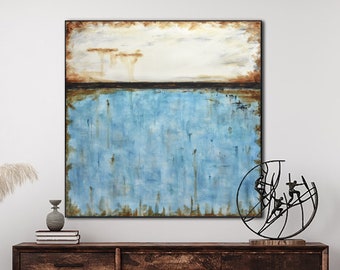 May include: Abstract painting with a blue and brown color scheme. The painting is framed and hanging on a white wall above a wooden dresser. A black metal sculpture is on the dresser.