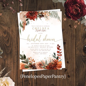 May include: A bridal shower invitation with a watercolor floral design in shades of red, orange, and green. The text reads "You're invited to celebrate Chelsea Elizabeth Hopkins at her bridal shower" and includes the date, time, and location of the event. The invitation also includes the text "Penelopes Paper Pantry".