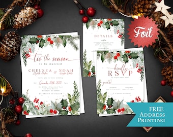 May include: A wedding invitation suite featuring white cardstock with watercolor holly, pine branches, and red berries. The text reads Tis the season to be married, Chelsea & Noah, Details, and Kindly RSVP. Includes a red foil starburst label.