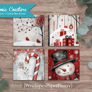 May include: Four ceramic coasters, each 4x4 inches with cork backing, featuring winter-themed designs. One coaster shows a tree with red berries and birds. Another displays wrapped gifts. A third has a candy cane, and the last one shows a snowman.