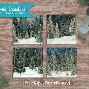 May include: Set of four 4x4 inch ceramic coasters with cork backing. Each coaster features a winter forest scene with snow-covered ground and trees decorated with twinkling lights. The coasters are perfect for adding a touch of winter charm to your home.