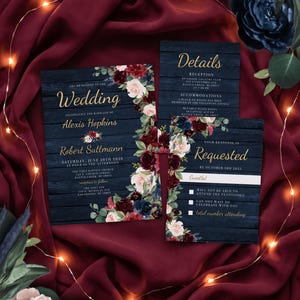 May include: A wedding invitation suite featuring a dark navy blue wood grain background with floral accents in burgundy, blush, and navy. The text includes names Alexis Hopkins and Robert Suttmann, event details, and a response card with gold lettering.