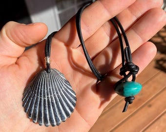 seashell pendant necklace with turquoise bead, fine silver wire, black leather cord, outer banks of North Carolina seashell, black seashell