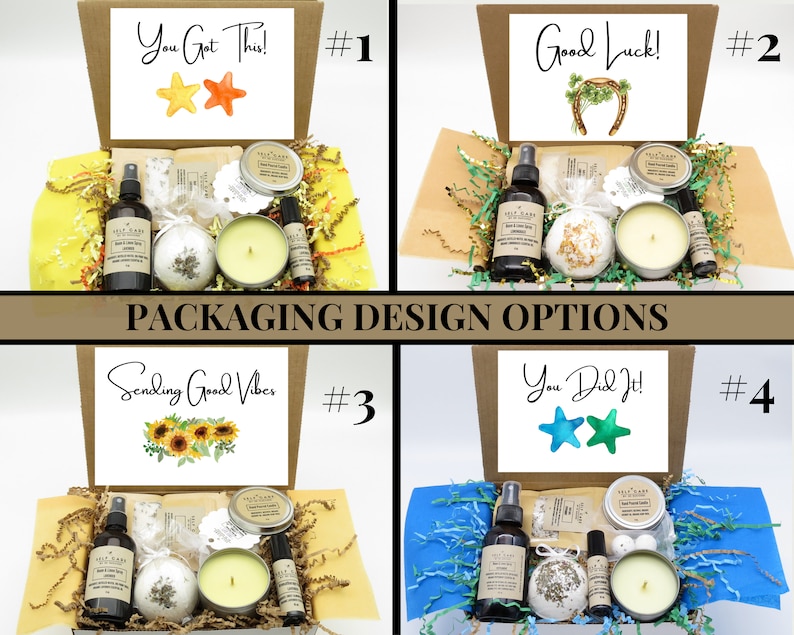 May include: Four cardboard gift boxes containing self-care items including a spray bottle, a bath bomb, a candle in a tin, and a roller bottle. Each box lid features a unique message: You Got This, Good Luck, Sending Good Vibes, and You Did It.