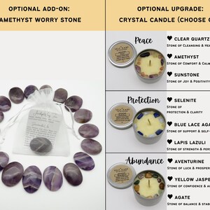 May include: A collection of oval purple amethyst worry stones arranged in a circle around a white drawstring pouch, alongside three metal tins containing cream-colored candles topped with various crystals labeled Peace, Protection, and Abundance.