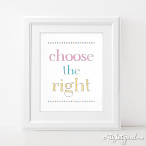 May include: A white framed print with the text "choose the right" in pink, blue, and yellow lettering with a gray outline. The text is surrounded by a row of small colorful dots.