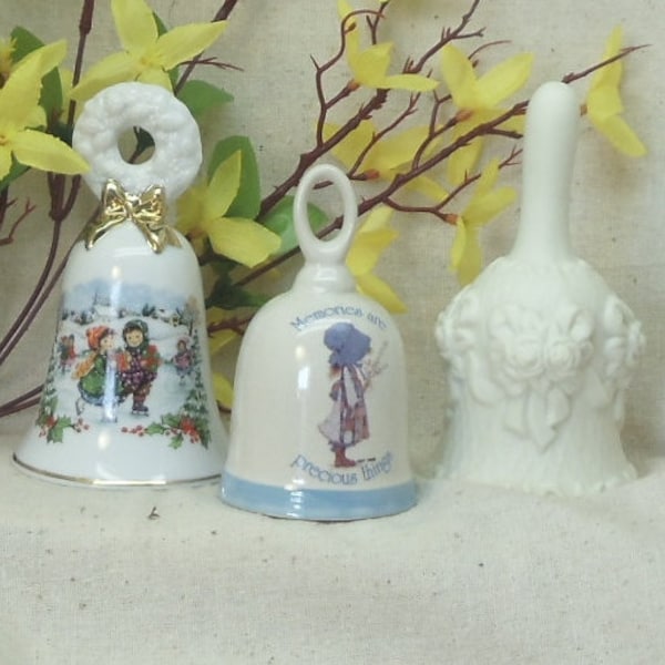 Three Collector Bells; Avon Christmas 1986 ,Holly Hobbie Memories, and White Floral Embossed Bell,#VB7030