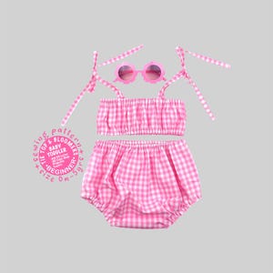 May include: A pink and white gingham tie-strap crop top and matching bloomers set, accompanied by pink flower-shaped sunglasses. A circular graphic includes the text: Sewing pattern, Tie top & bloomers, Baby toddler, Size 0m-5yrs, A4/US Letter, A0 Copy Shop, Projector, Layers.