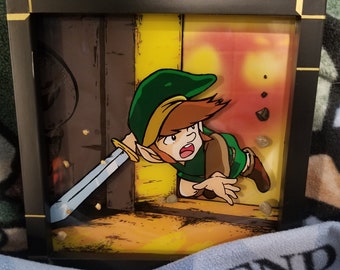 Arte em caixa de sombra pintada em camadas, inspirada em Link, da série The Legend of Zelda.